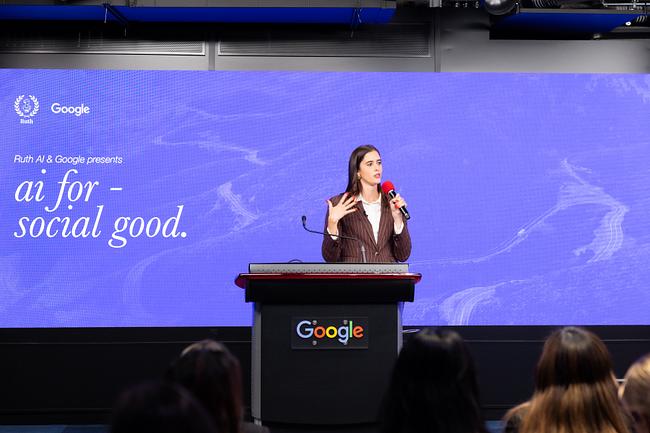 Valerie Chapman speaking at Google San Francisco with the AI for Social Good event title visible